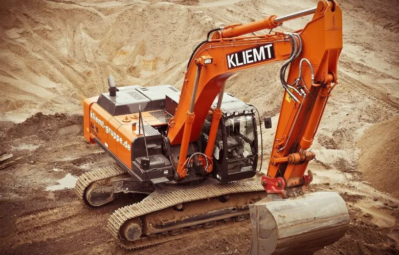 Tracked excavator in a sand pit