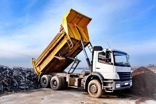 Tipper truck lifting its load