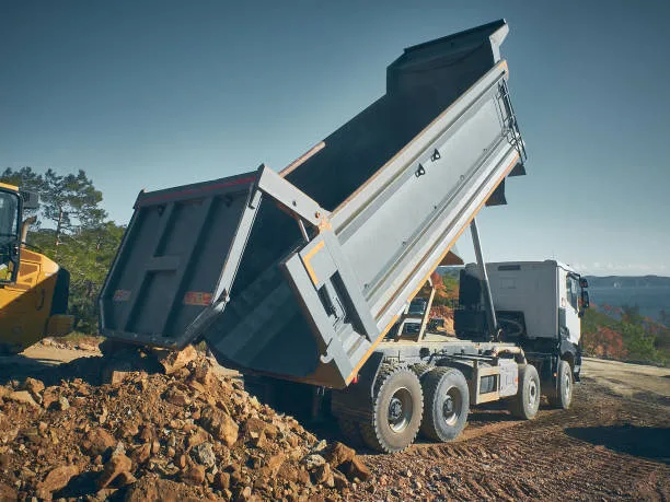 Tipper truck offloading rock